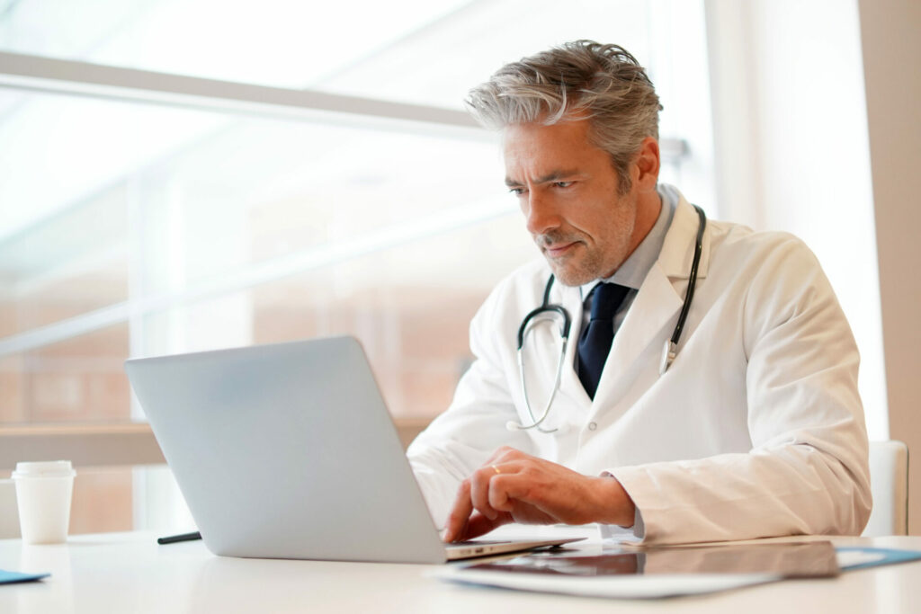 doctor working on his computer